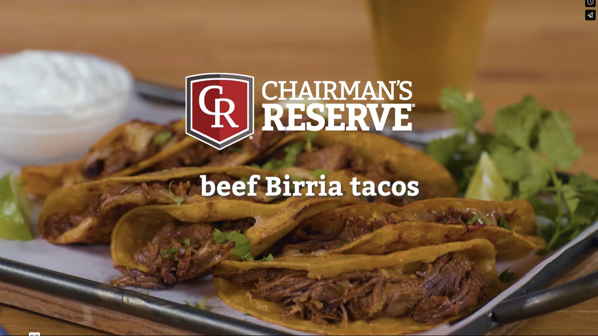 Chairman’s Reserve Meat’s logo laid over a platter of prepared beef birria tacos 